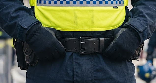 PSU police officer wearing leather public order belt