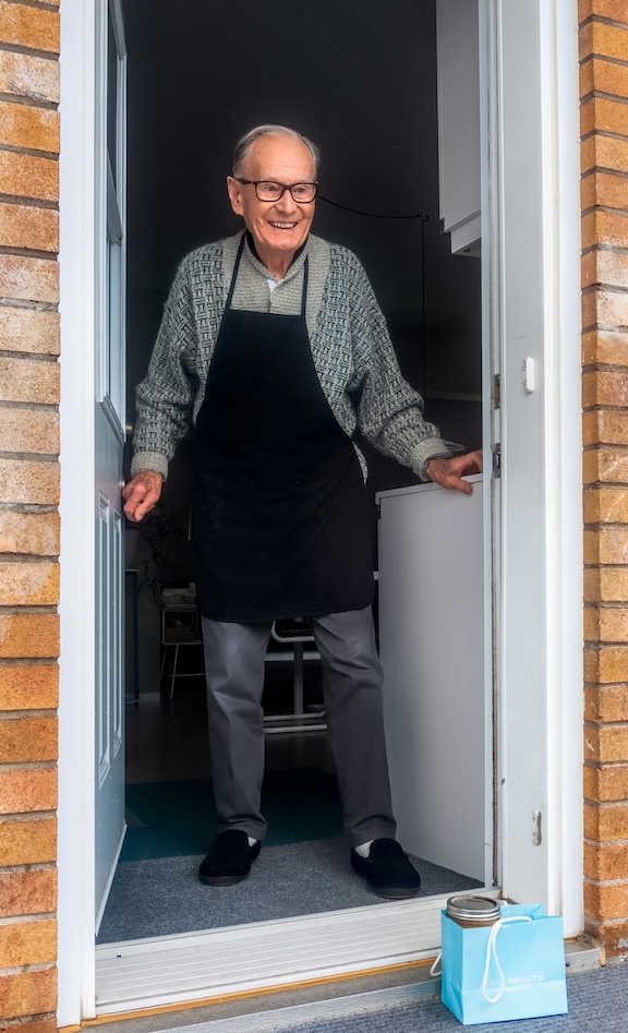 Old man answering door