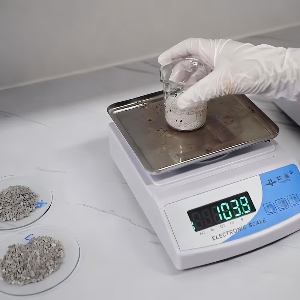 R&D personnel in a laboratory analyzing different desiccant strip samples and raw materials to develop customized desiccant formulations.