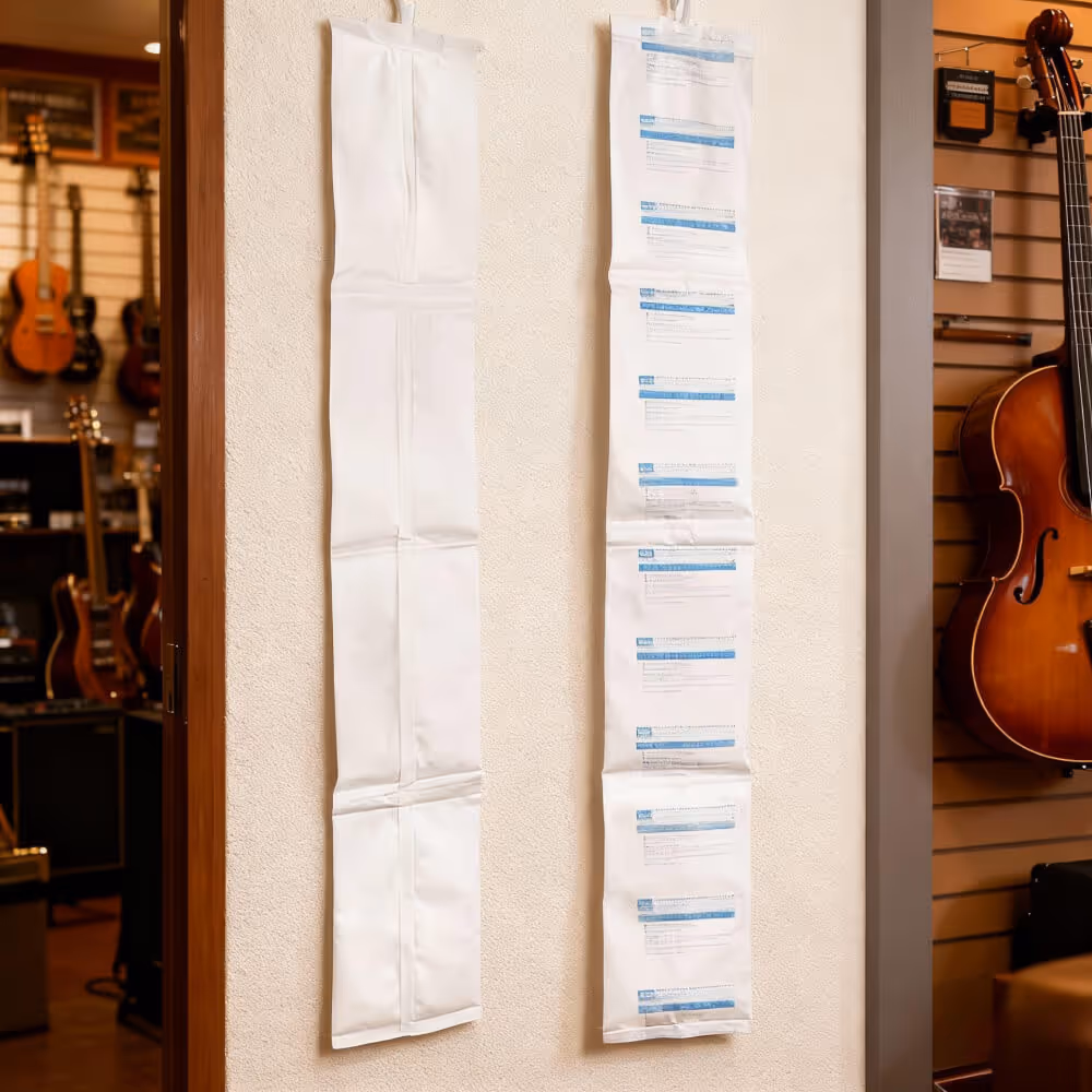 There are white desiccant strips attached to the walls of the instrument store to maintain optimal humidity and prevent wood warping.