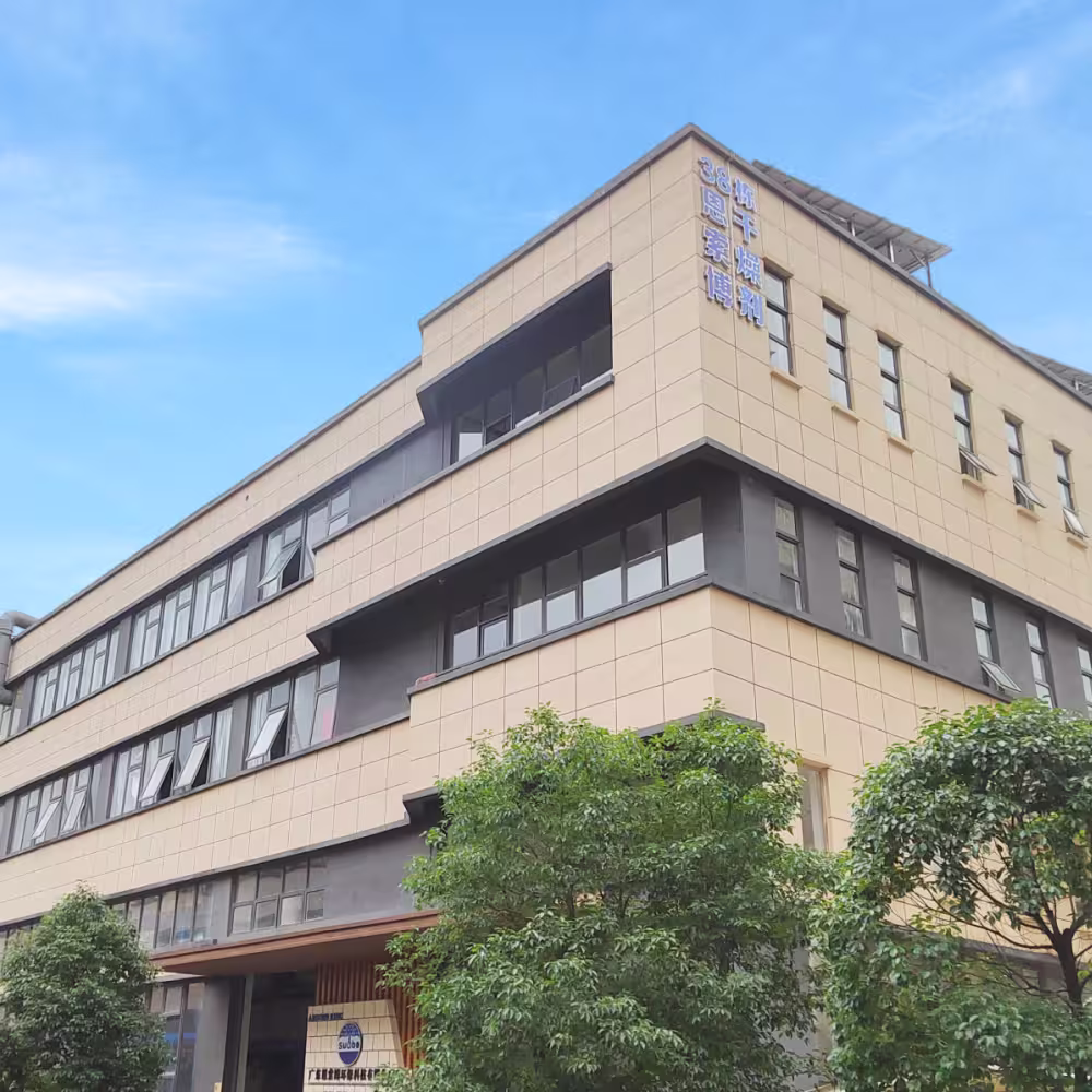 A 4-story building with an absorbing sign at the top corner.