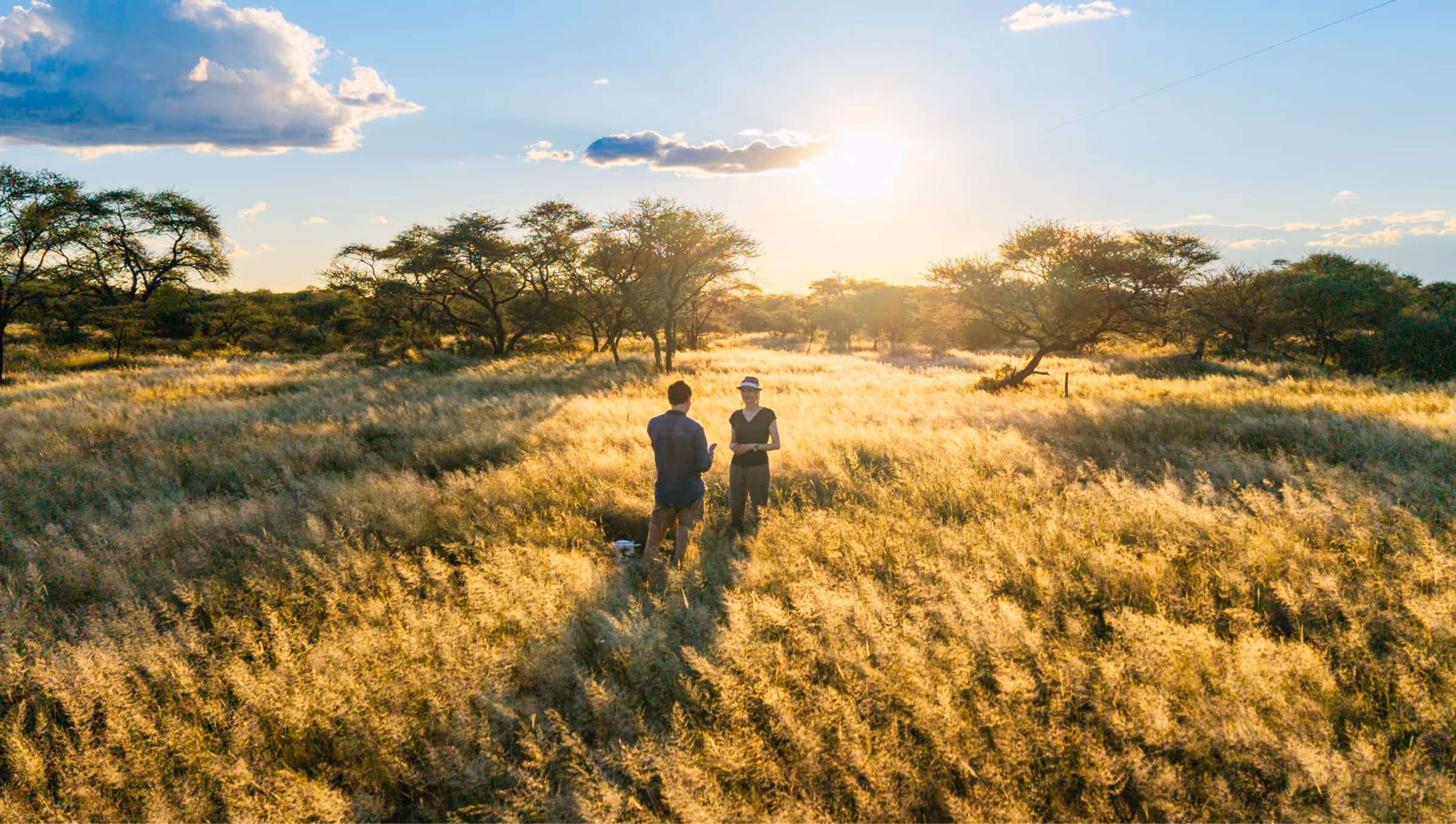 The co-founders of Carbonsate standing in the landscape of Namibia
