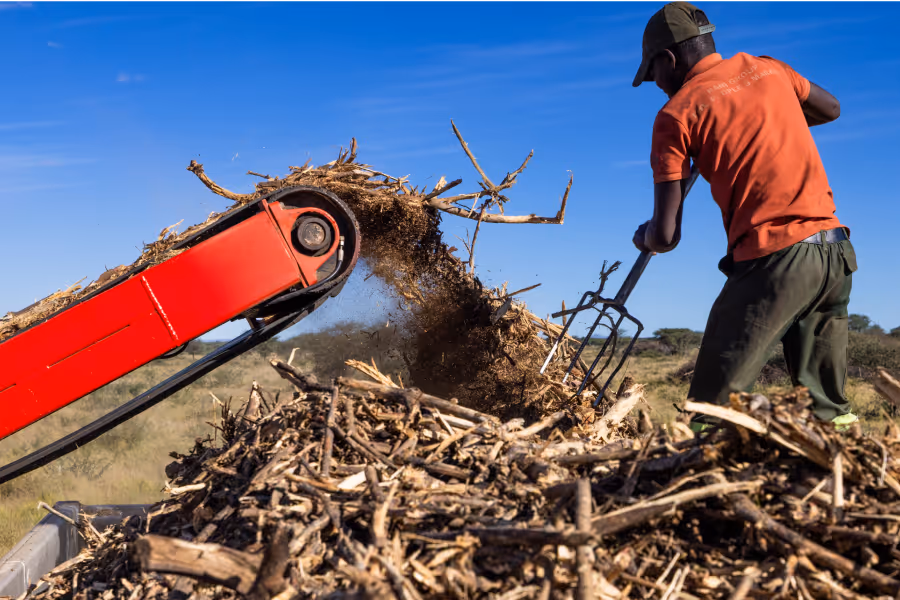 A farm worker working with biomass in Namibia