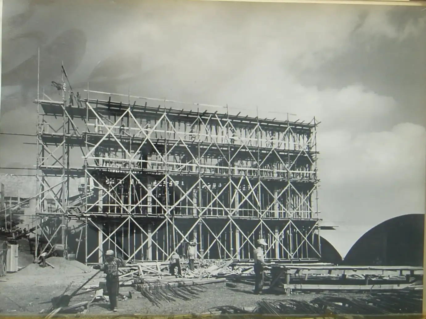 building structure and workers building it