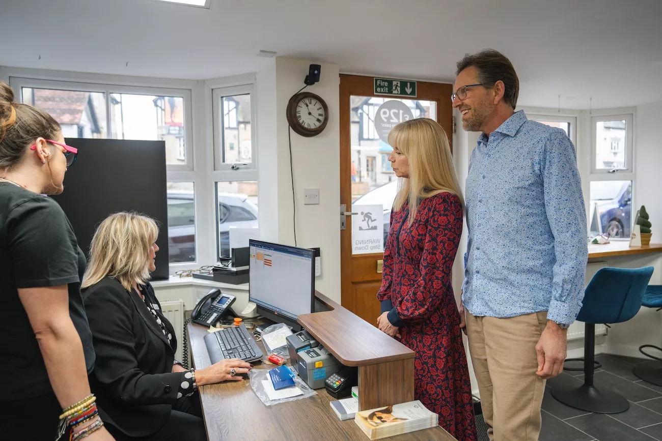 Patients being welcomed at the Richard Fantom Eyecare reception desk