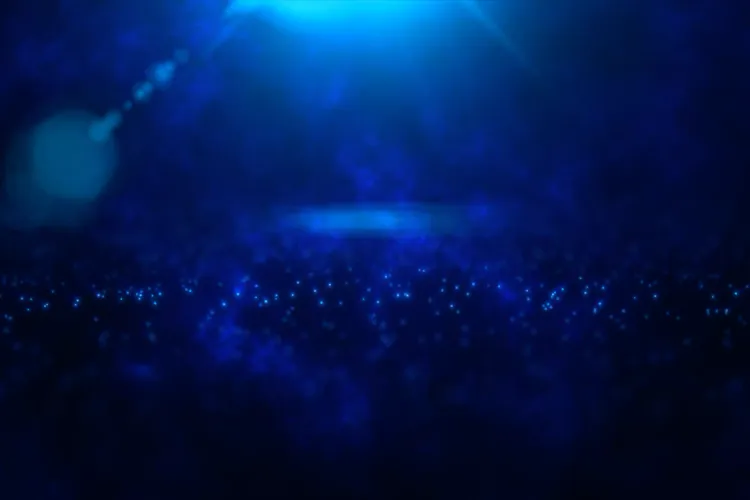 Deep blue abstract background with glowing particles and soft light.