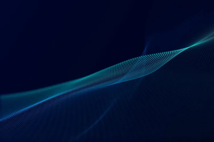 Blue digital wave of interconnected particles on dark background.