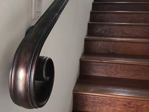 Custom staircase railings, balcony railings, and handrails with wood and iron integration
