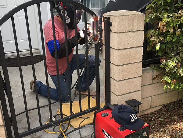 Custom wrought iron fences and gates fabrication, repair, and installation services