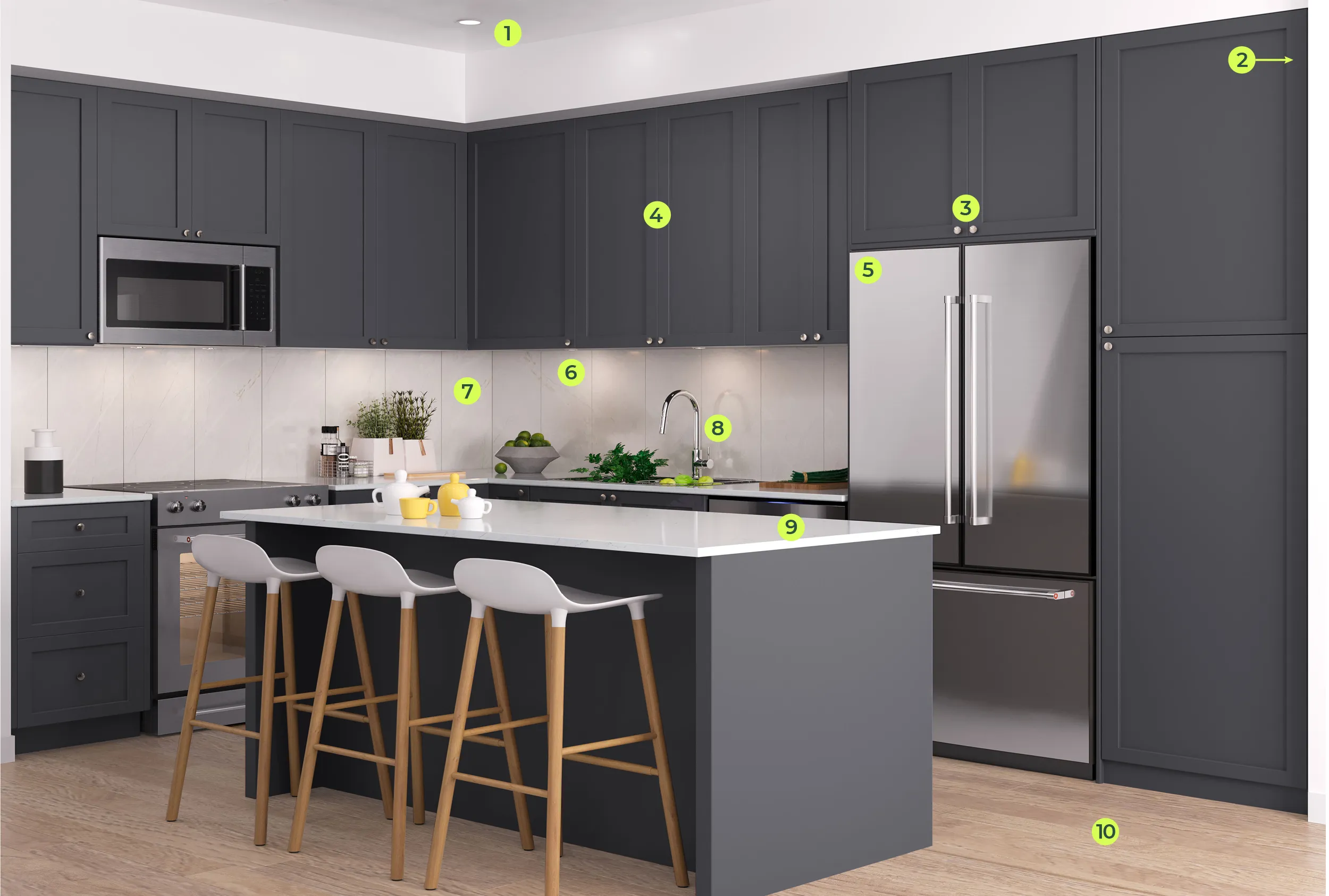 Modern kitchen with dark gray cabinets, a stainless steel refrigerator, built-in microwave, three wooden stools with white seats at a white countertop island, and light wood flooring.
