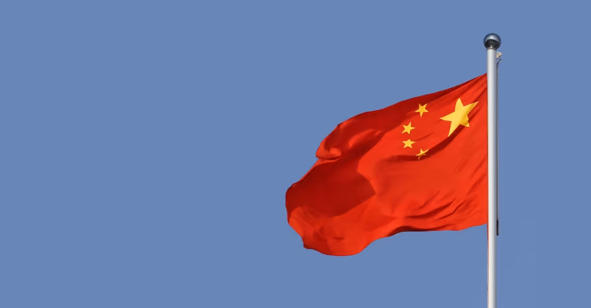 Chinese flag against a blue sky