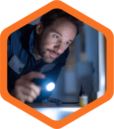 Technician performing a careful pest inspection