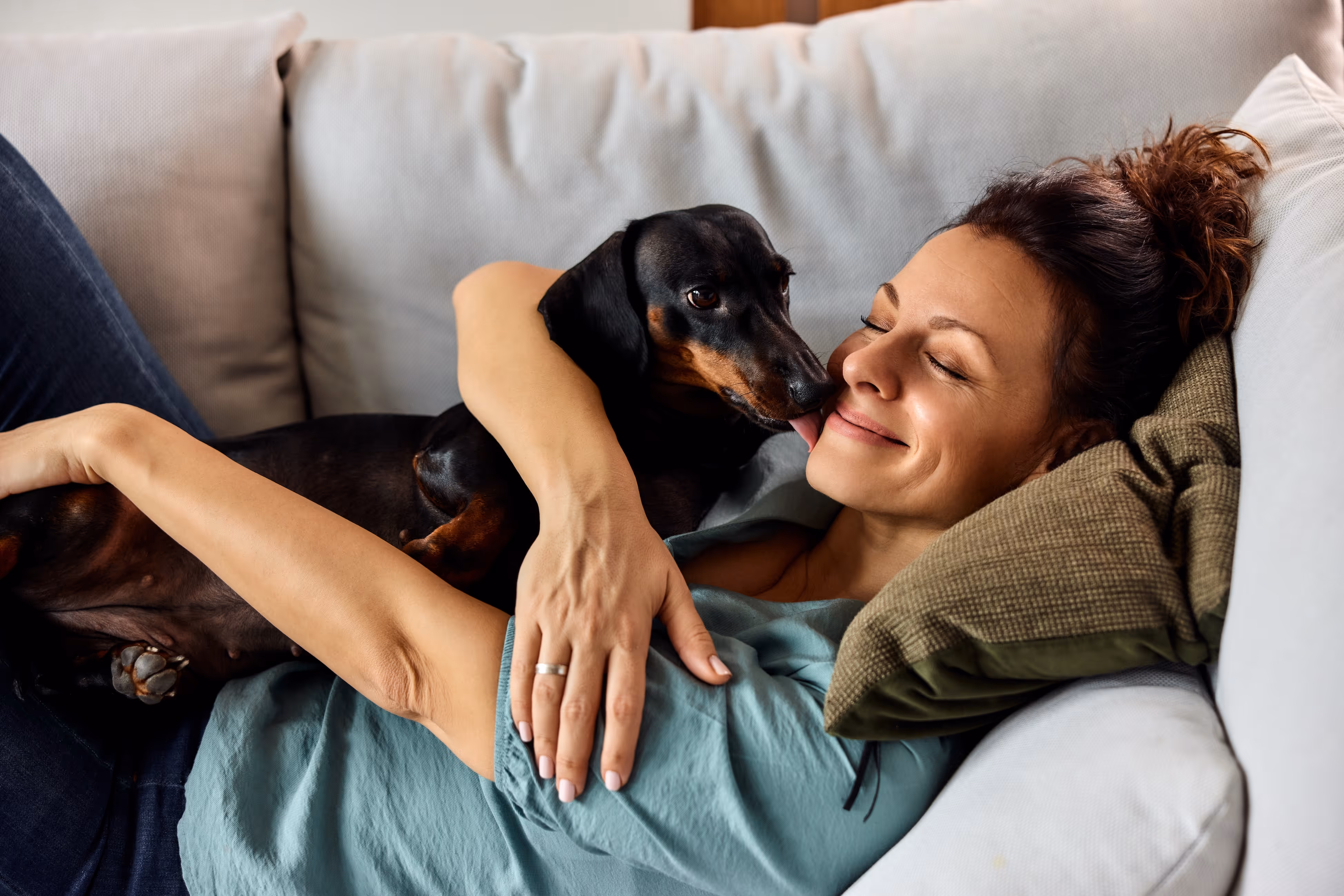 Mom and daughter smiling and hugging stock image
