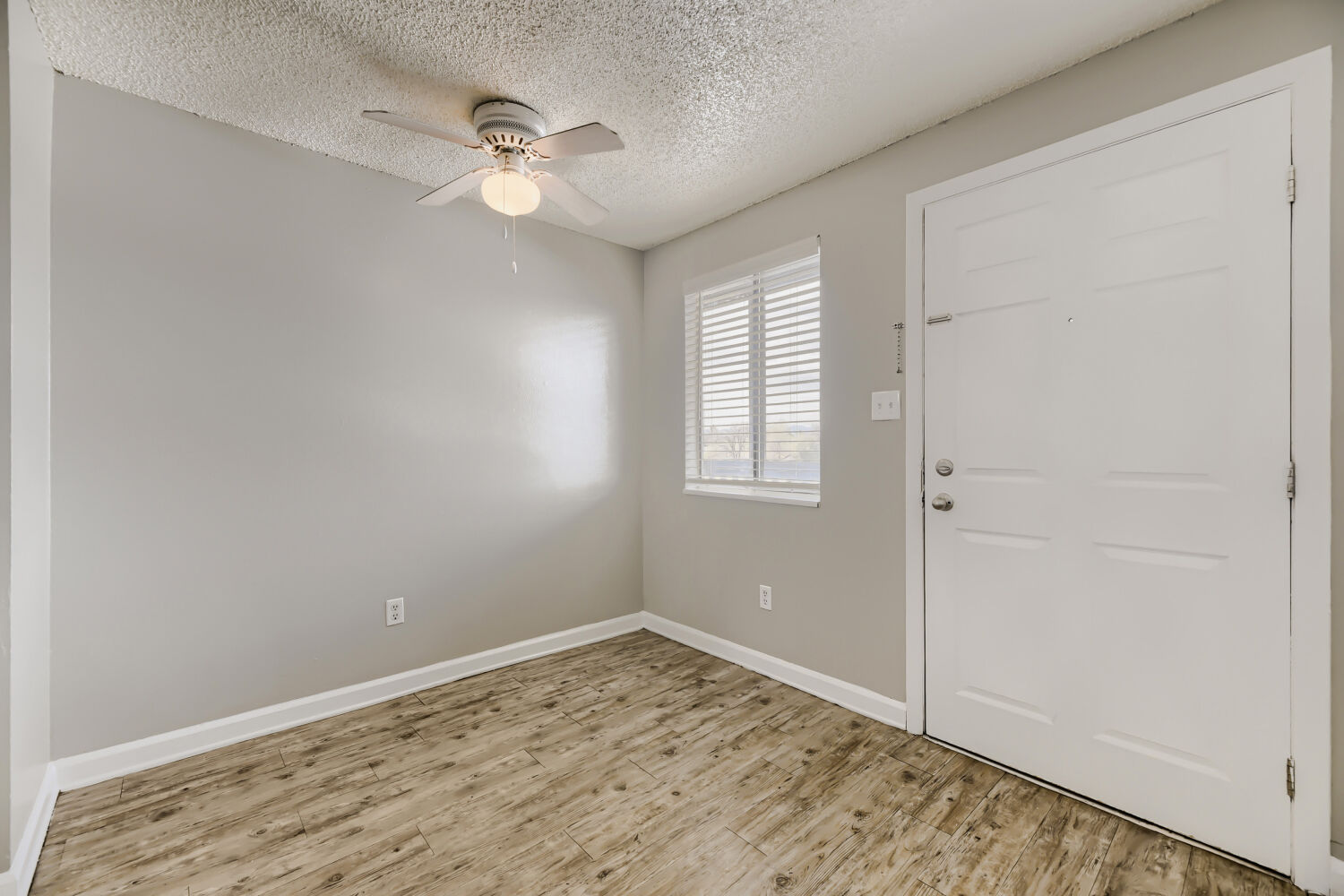 Empty room with entrances to closet and hallway