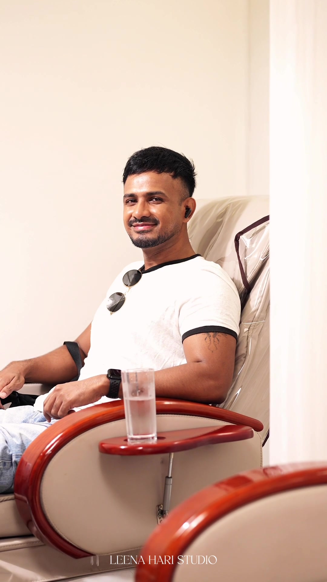 Pedicure: the client smiling in the chair.