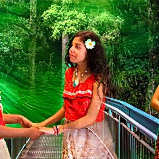 Students on stage in costume during the Moana, Jr. theater production