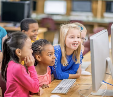 Students using computers for technology class
