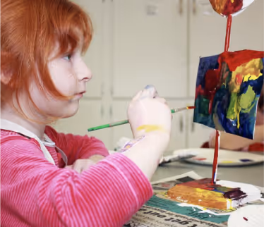 Students creating artwork in visual arts class