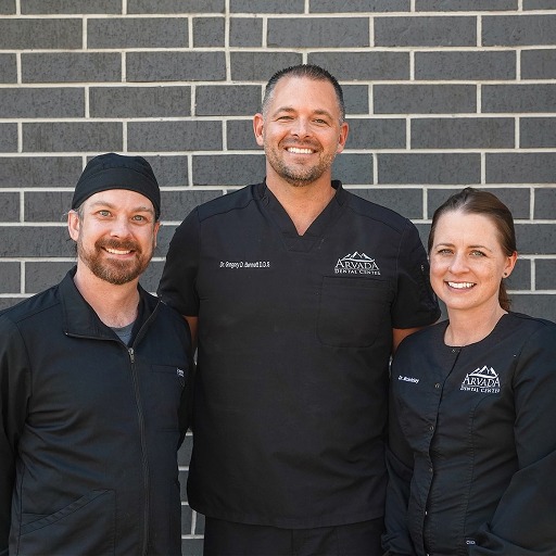 Three Arvada Dental Center dentists standing together outside the practice