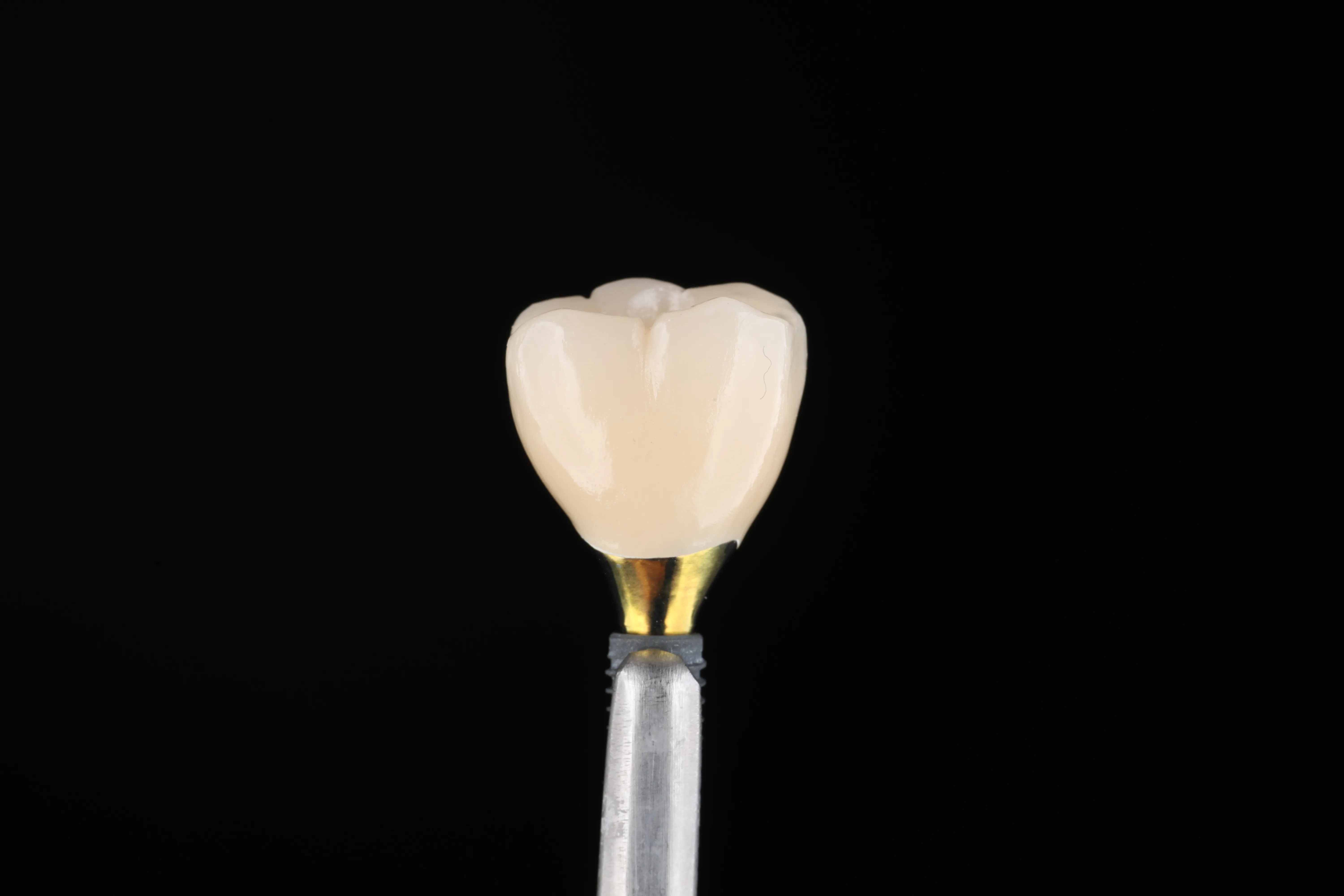 Single dental implant crown restoration on a holder
