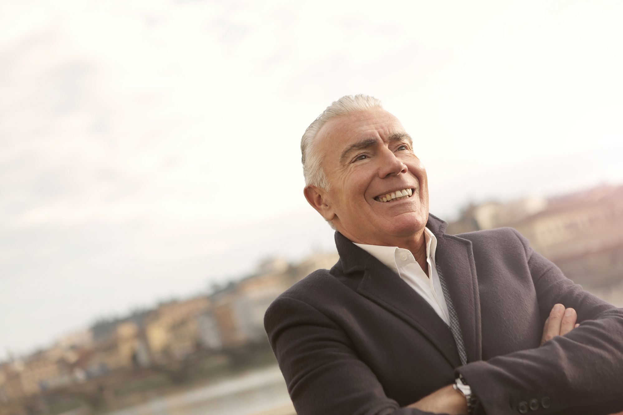 Confident mature man with a natural-looking smile standing outdoors
