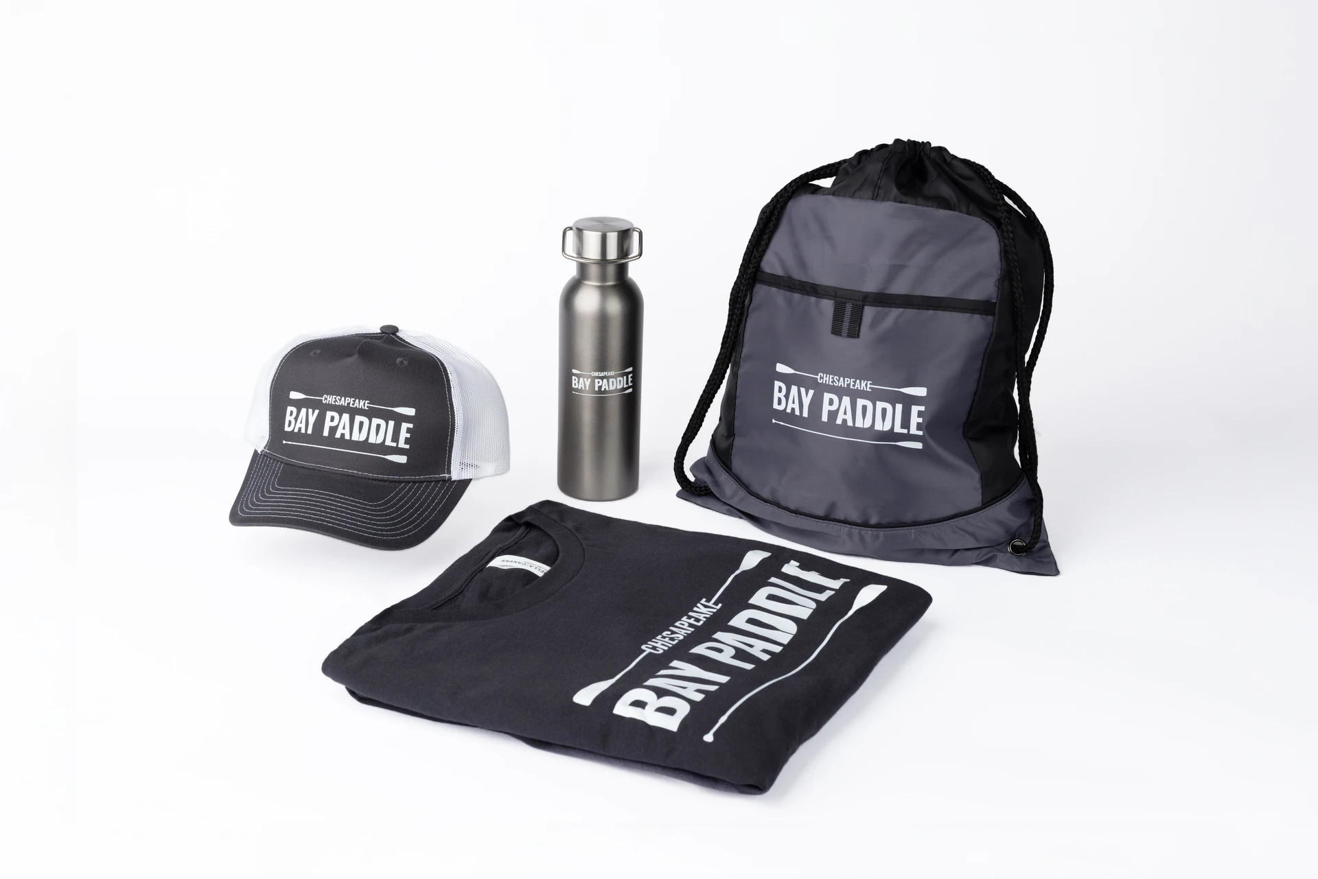 Bay Paddle finished branded shirt, cap, bag and bottle