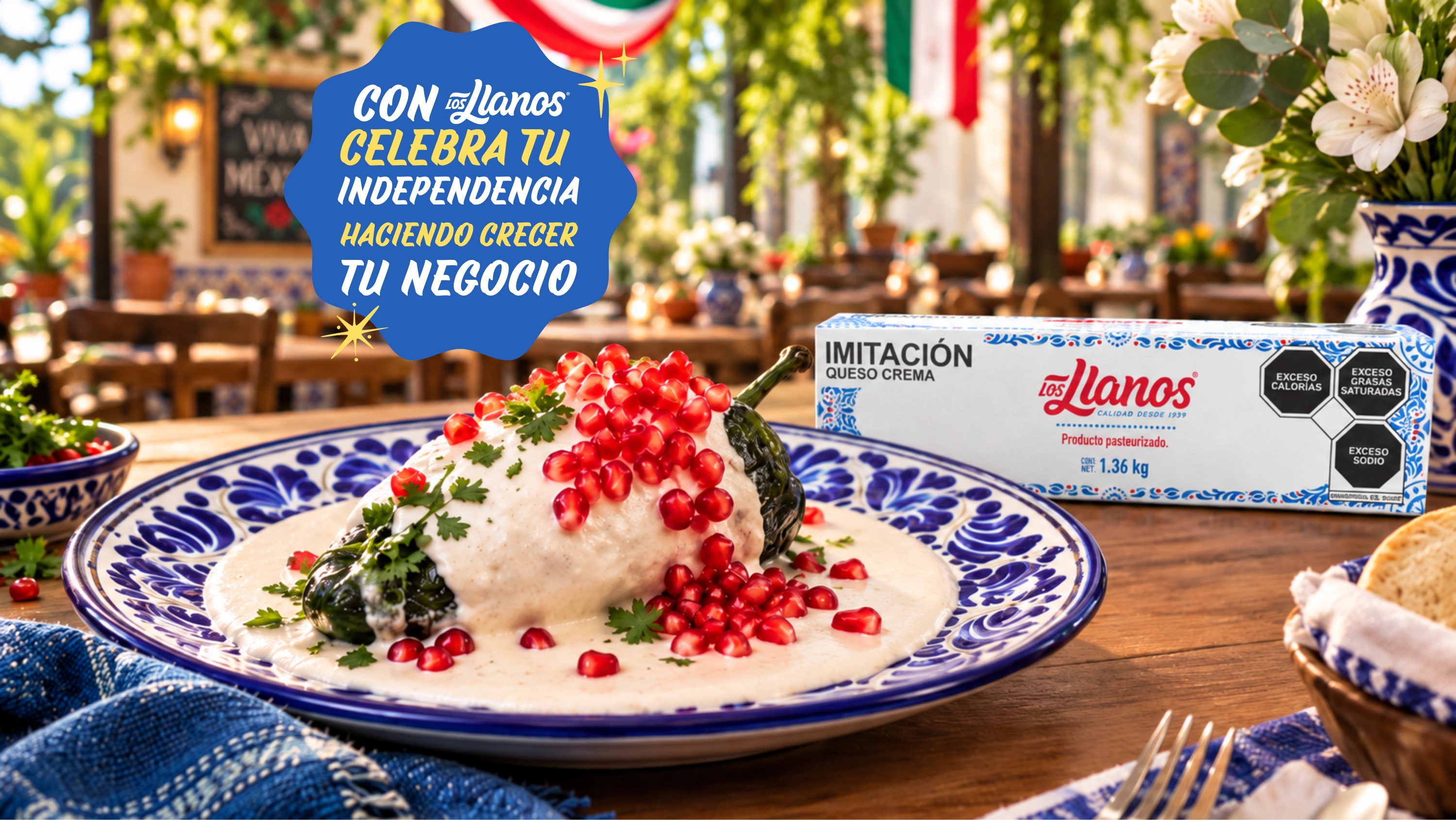 Banner publicitario de Los Llanos con un chile poblano relleno de nogada, decorado con granada y perejil, servido en un plato tradicional mexicano. Al fondo aparece el producto Los Llanos y un mensaje que dice: “Celebra tu Independencia haciendo crecer tu negocio”.