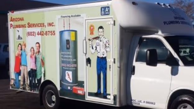 White service van with Arizona Plumbing Services branding, phone number, and images of a smiling family and plumber holding a wrench.