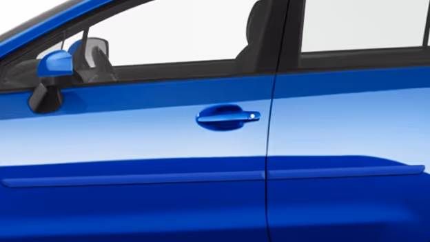Close-up of bright blue car side door with matching painted body side molding, door handle, and side mirror.