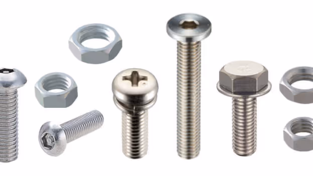 Close-up of various metal fasteners including screws and hex nuts on a white background.