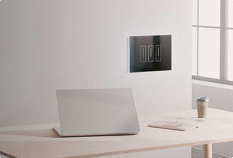 View of an iotty smart light switch showing its internal components and mounting plate