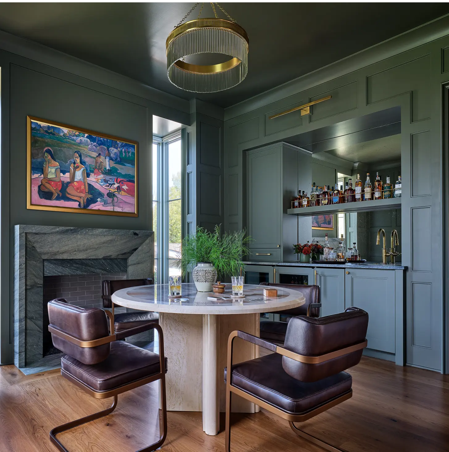Renovated dinning area with tables chairs, and light fixtures and a bar