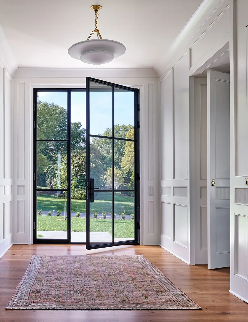 Large double door front entrance leading into a hallway