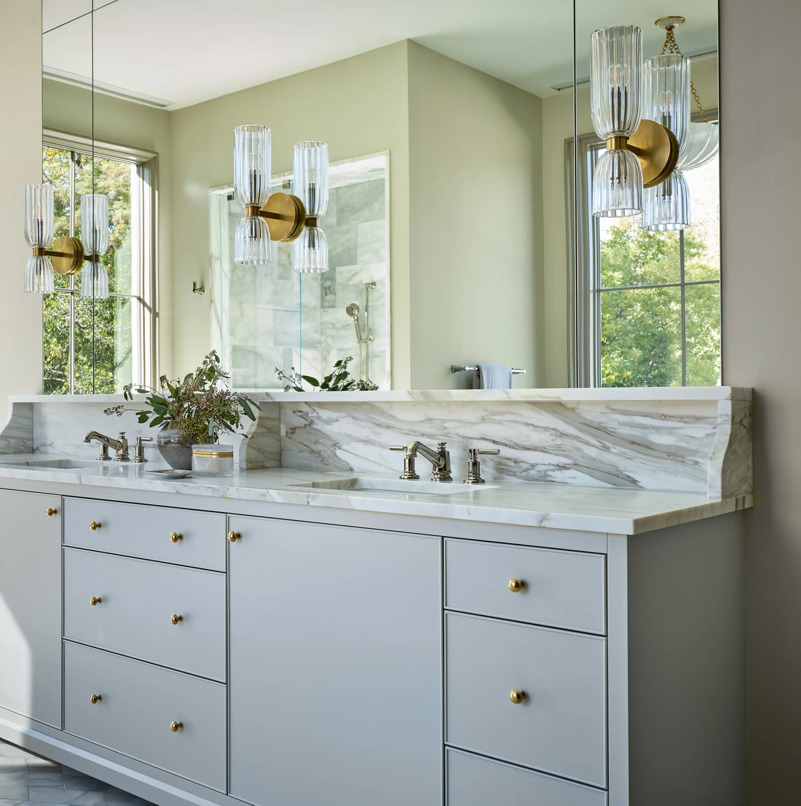 Bathroom mirror and sink with light fixtures