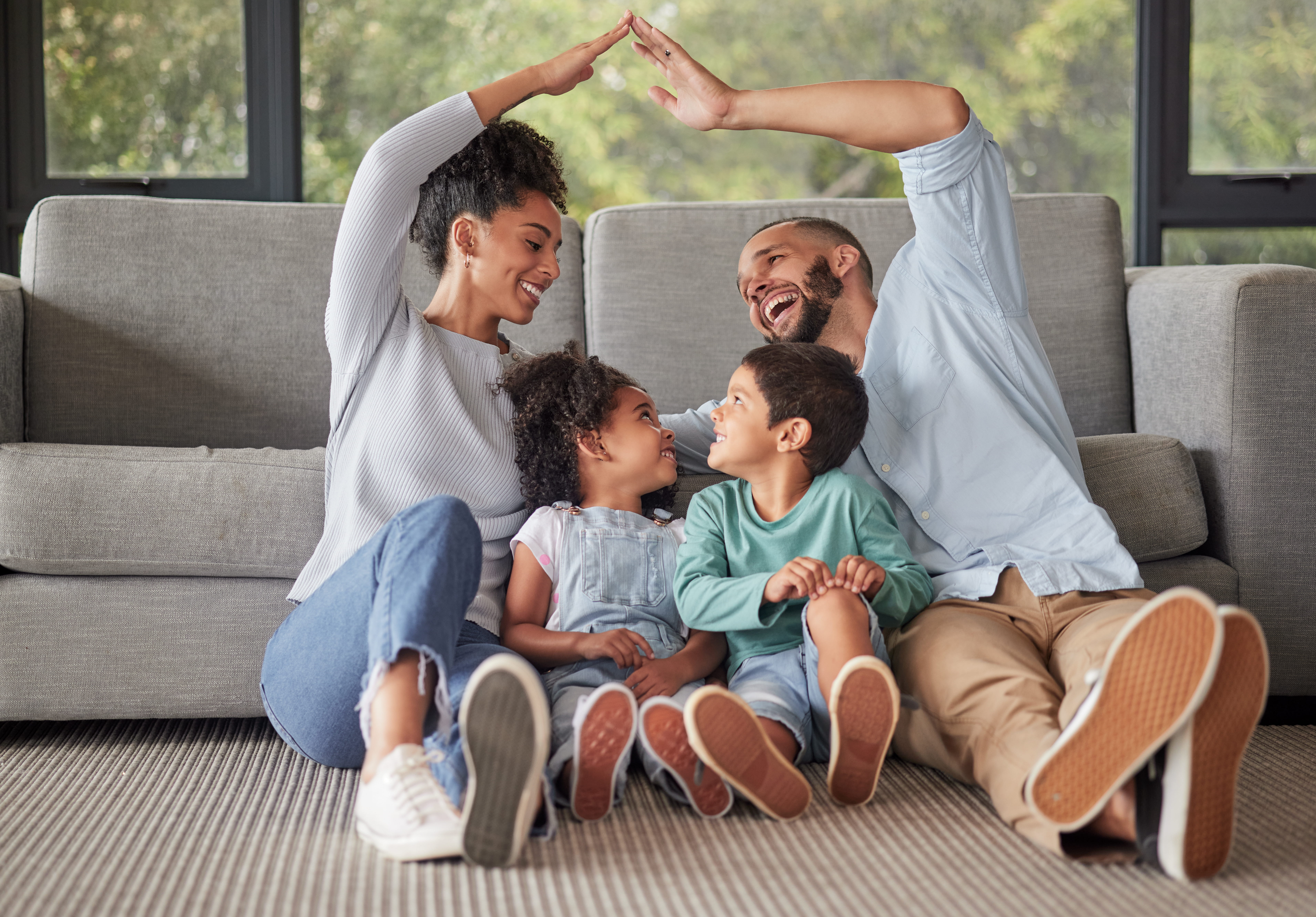 family laughing on floor stock image
