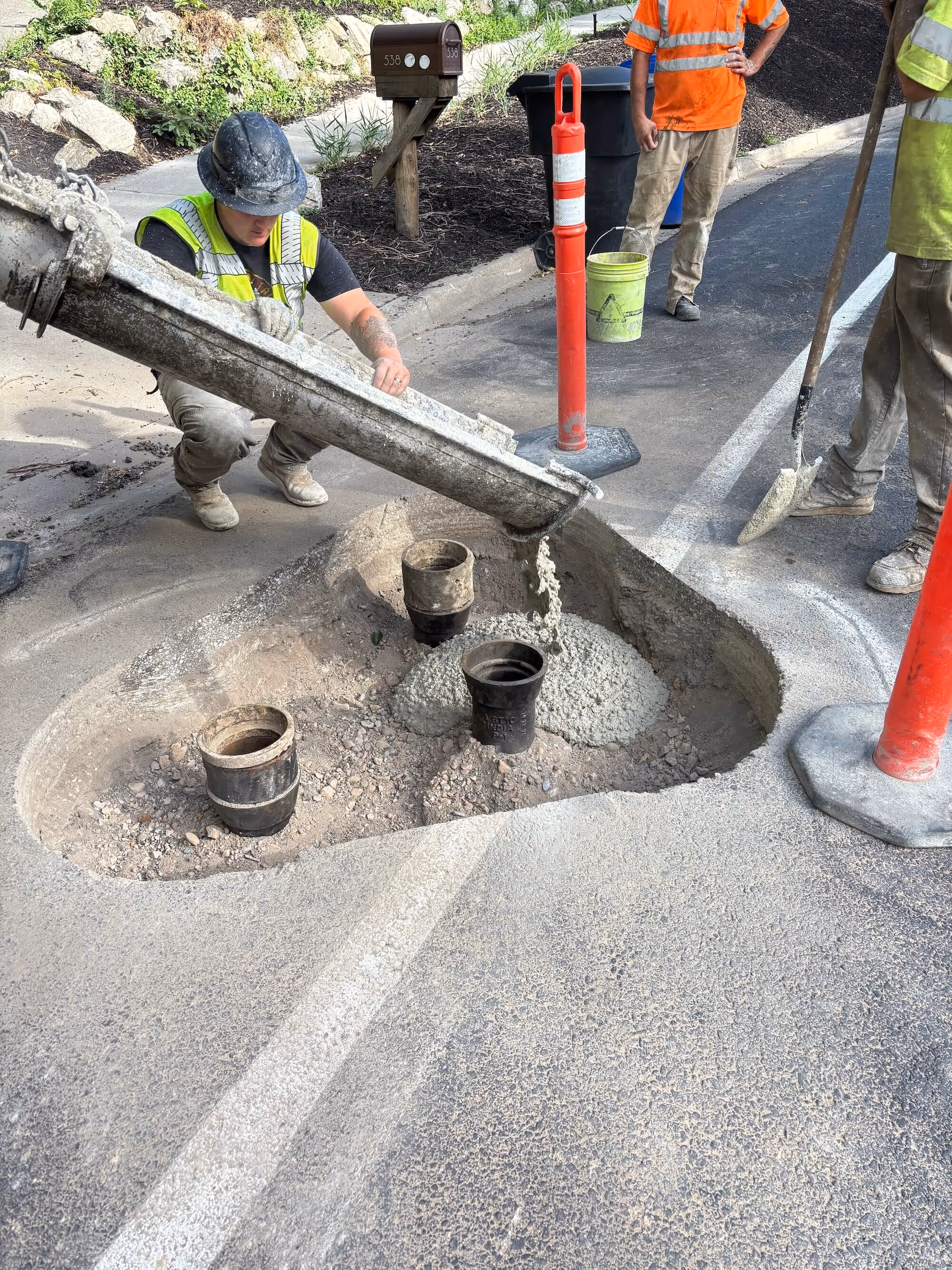 Workers working on a a manhole
