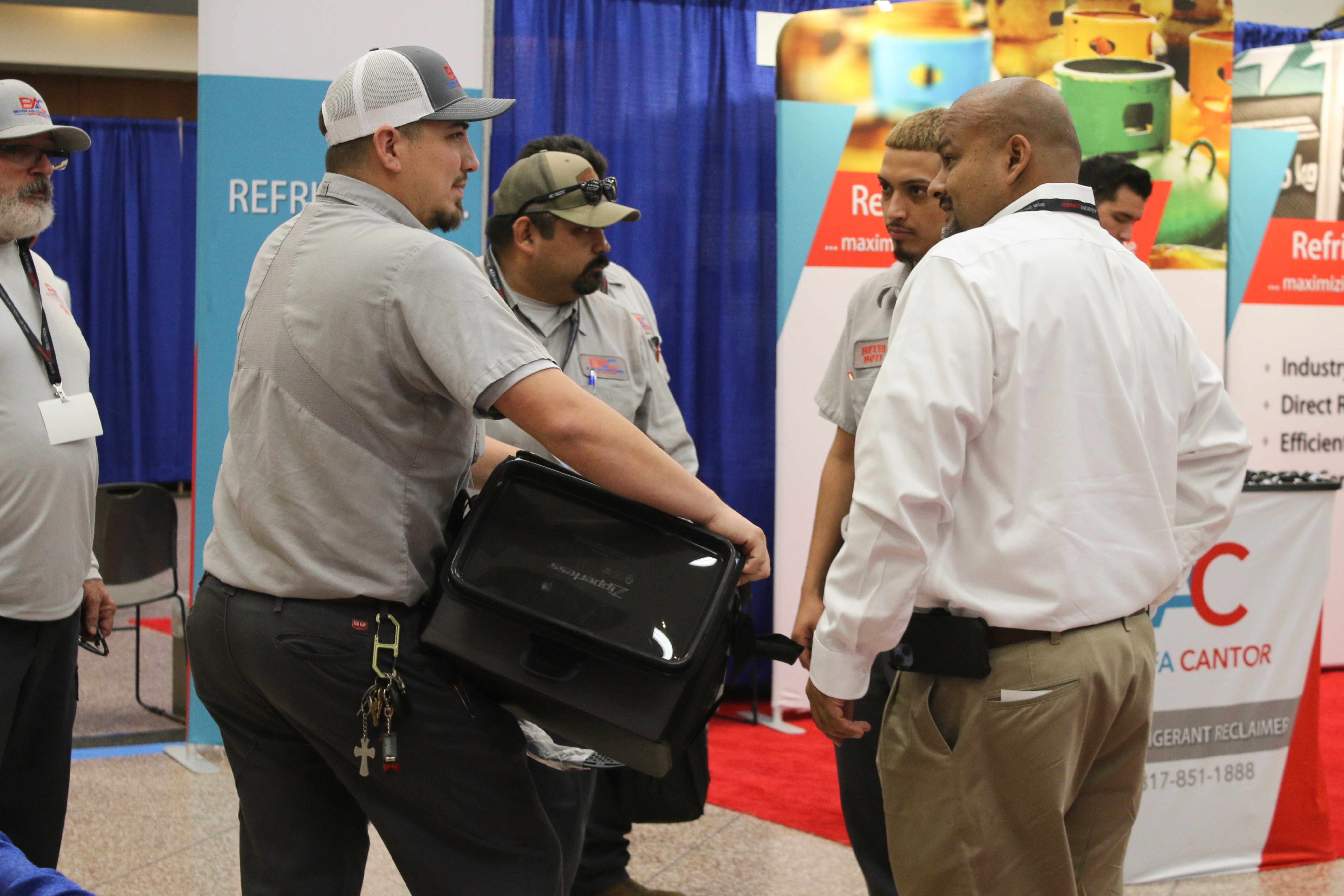 Technician inspecting outdoor AC units
