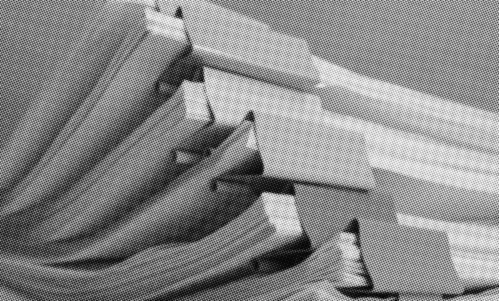 grayscale halftone image of stacks of paper bound together by binder clips and stacked on top of each other close up
