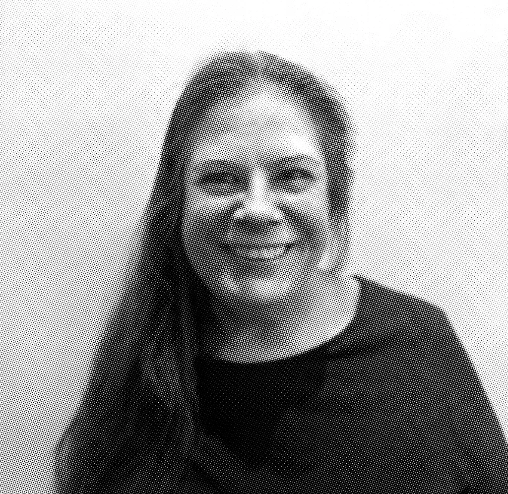 grayscale halftone image of Dr. Michelle Raab, smiling on a light backdrop