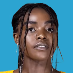 Portrait of a woman with braided hair against a blue background.