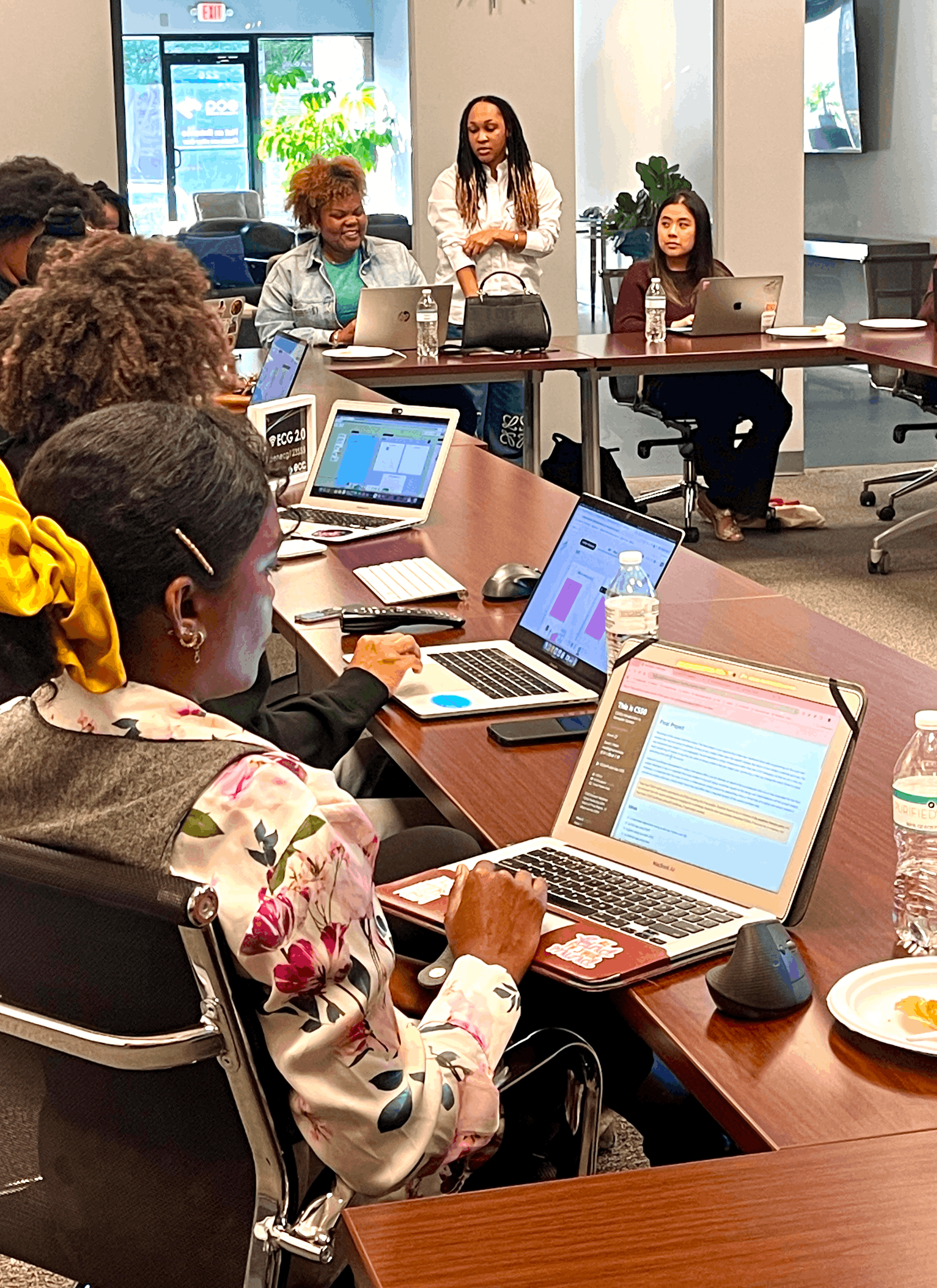 women in a classroom, on laptops