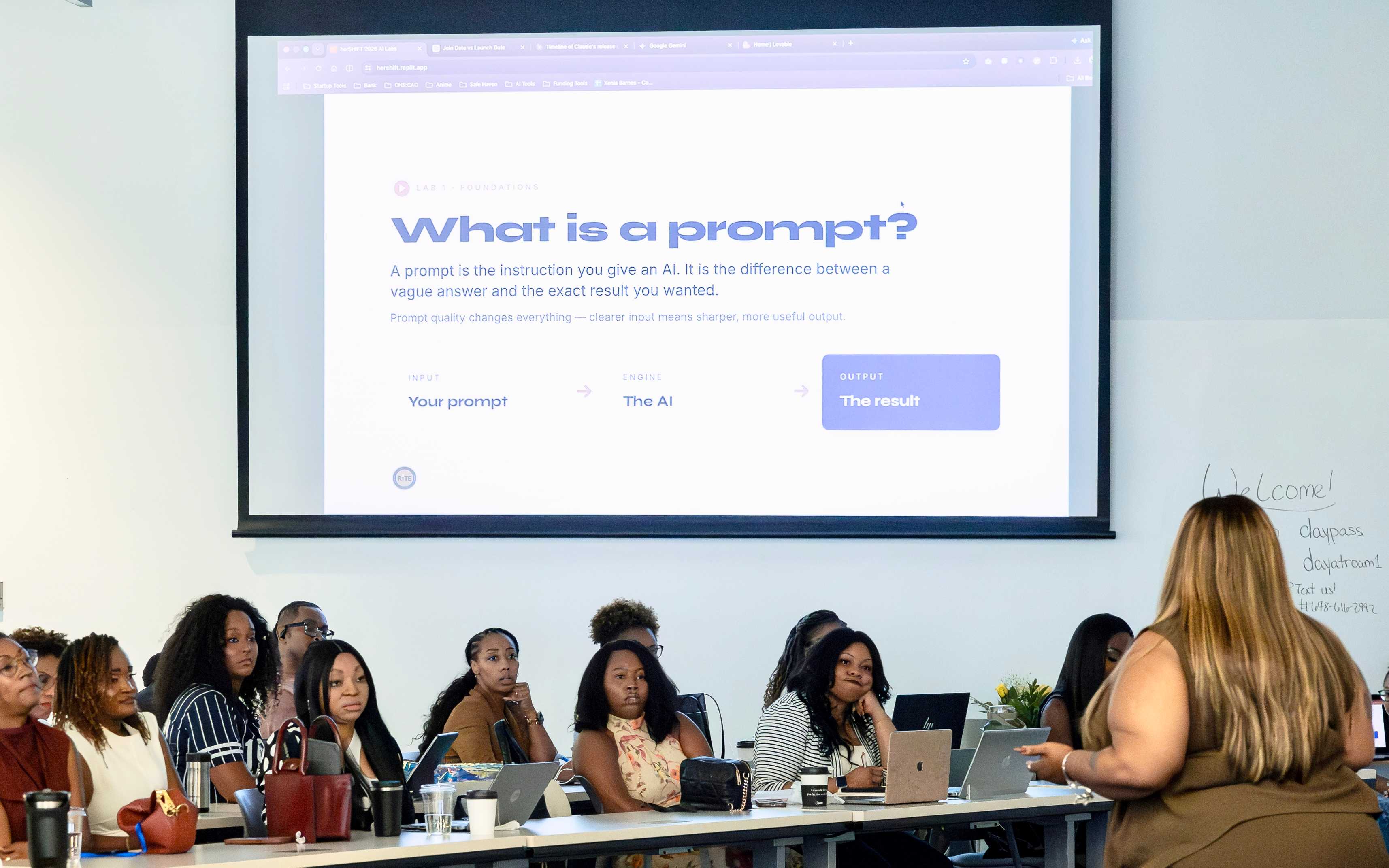 attendees at a desk, engaged in a workshop