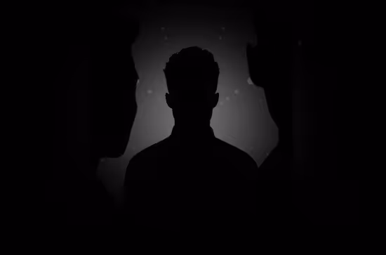 Silhouettes of three people against a dark background with subtle light and particles.