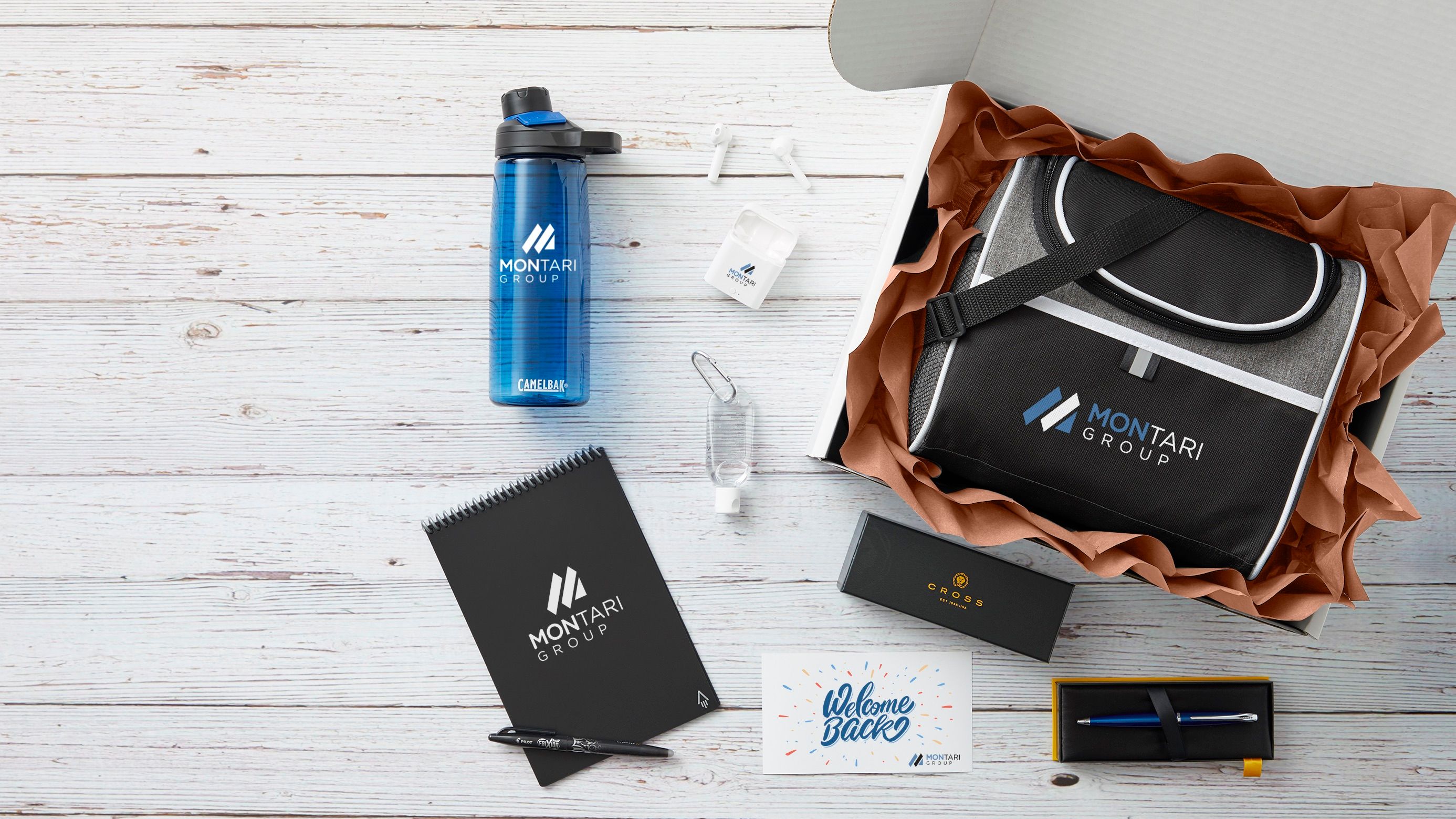 An image of a custom swag box and all the products inside the swag box branded with a company logo