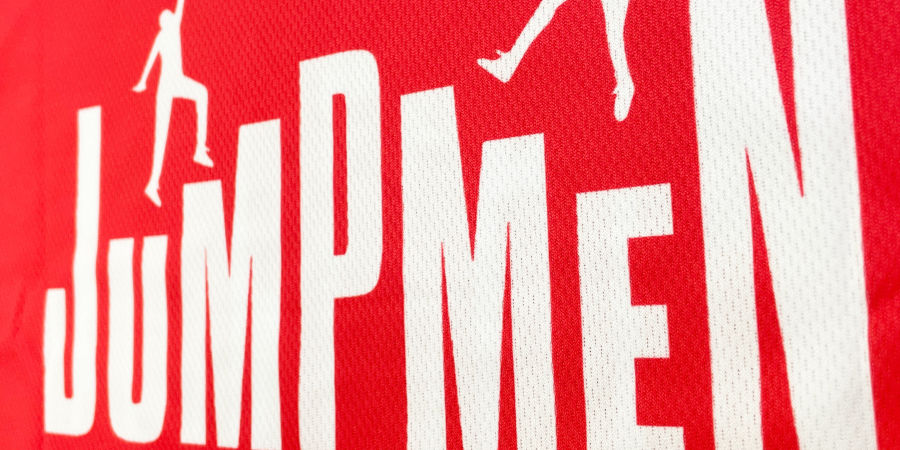 A super close up image of a sublimated jersey, showing how the design is printed directly into the fabric creating a seamless design.