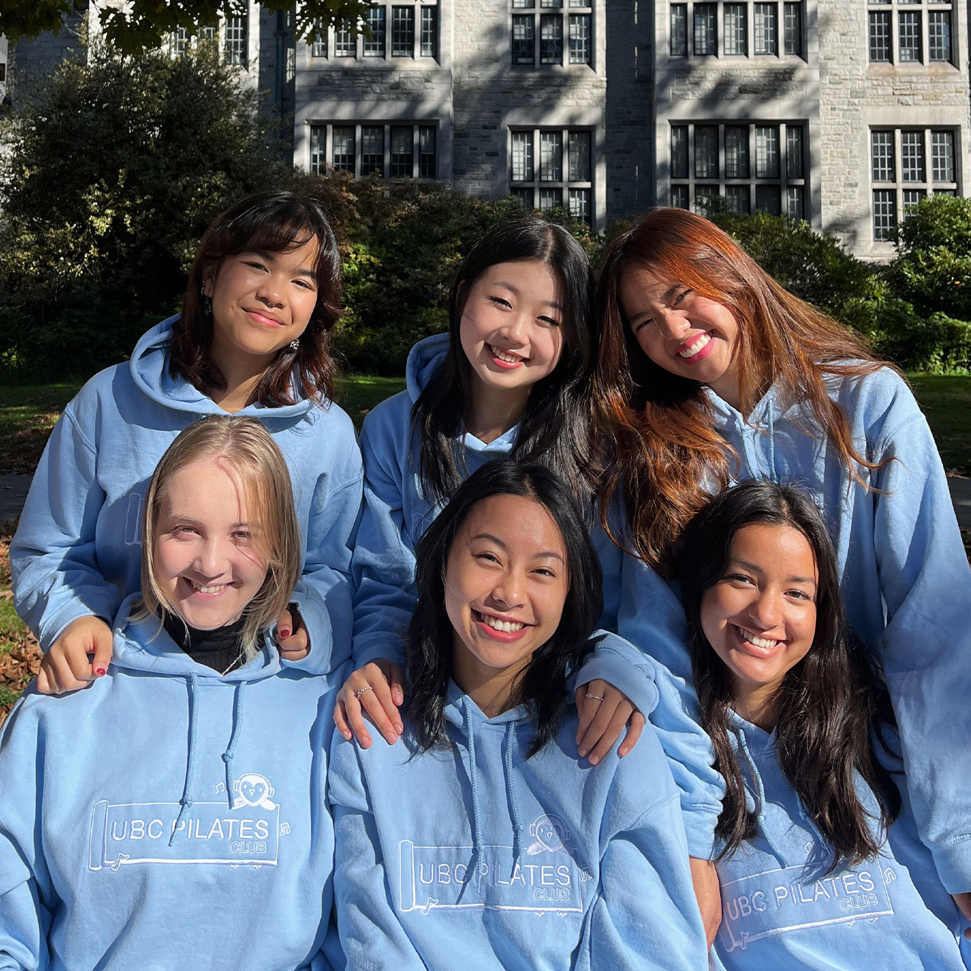 An image of the UBC Pilates club wearing custom hoodies printed by us.