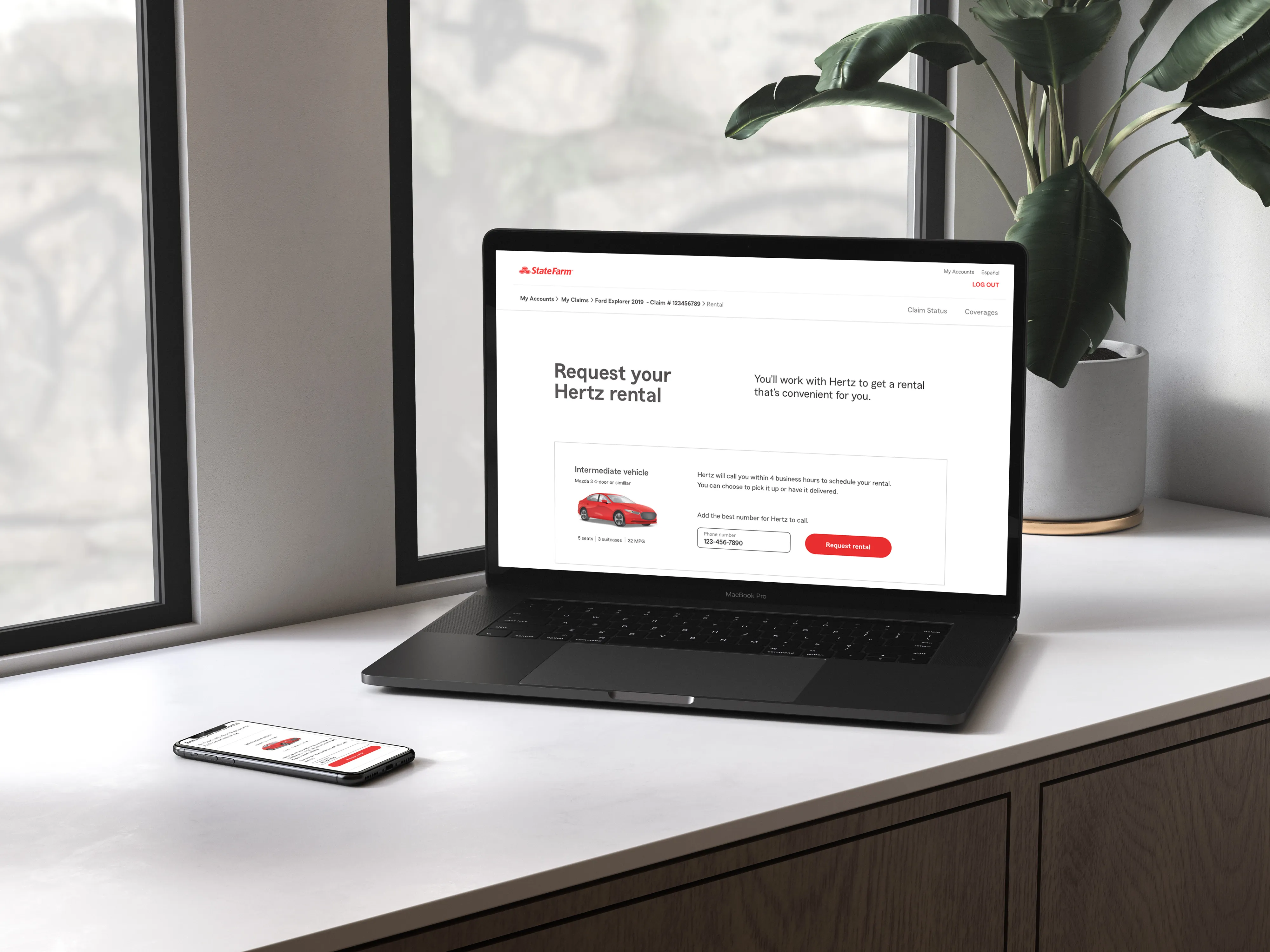 Laptop and smartphone on a white desk displaying a State Farm webpage to request a Hertz rental car.