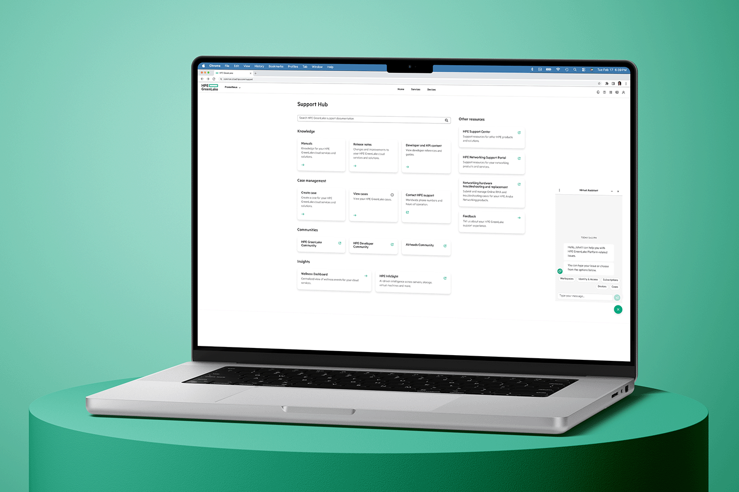 Woman working at a desktop computer displaying a support hub webpage with various help categories and resources.