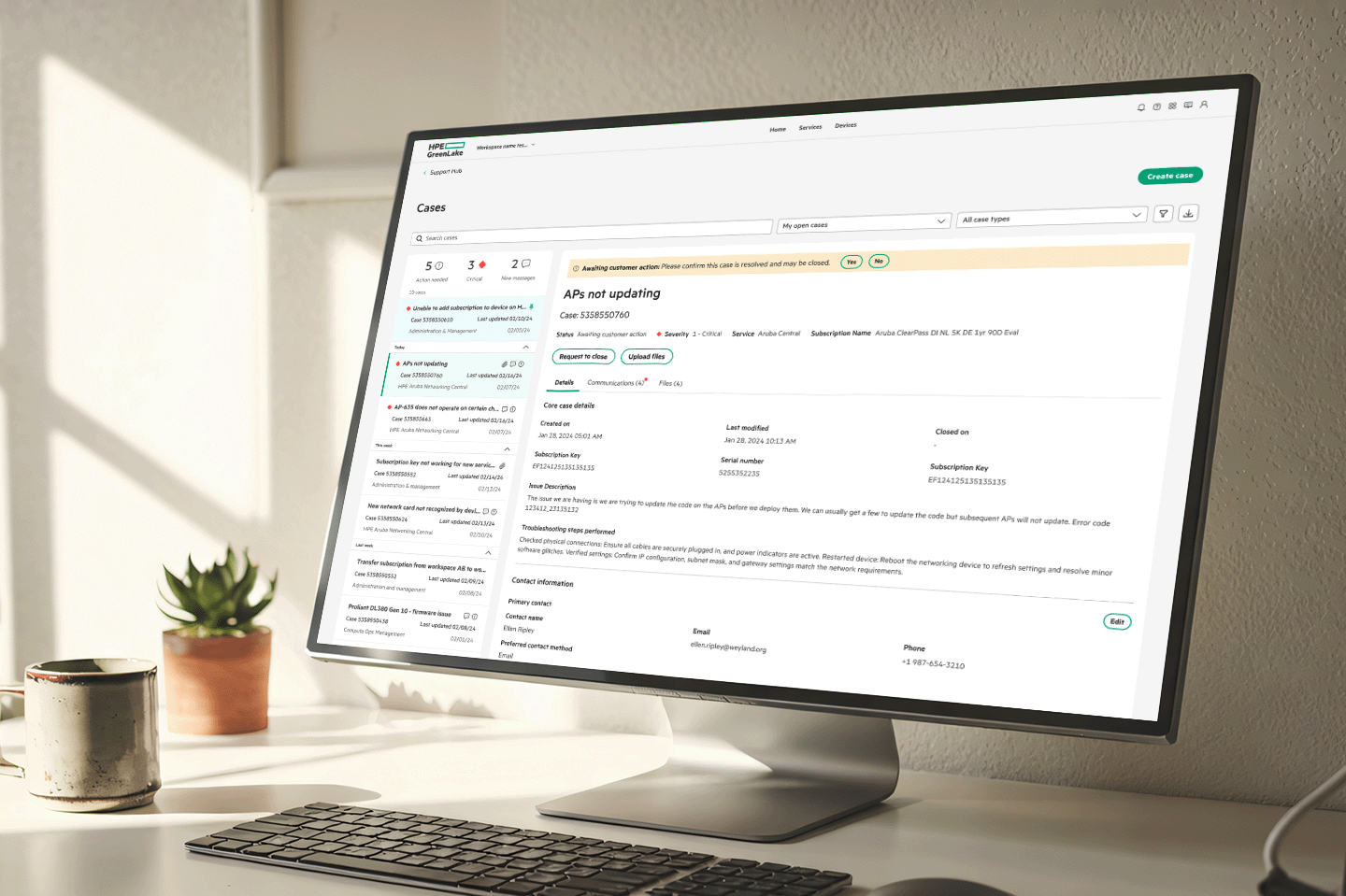 Computer monitor on desk displaying HPE GreenLake case management interface showing an open case about APs not updating.