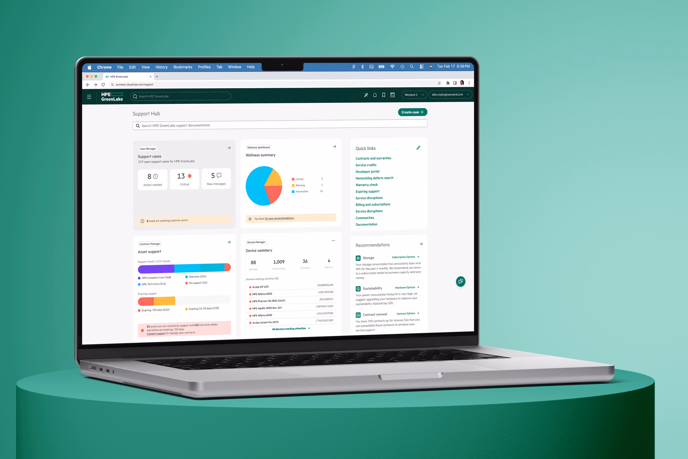 Person using a laptop displaying HPE GreenLake Support Hub dashboard with support cases, wellness summary pie chart, asset support bars, device summary, and quick links.